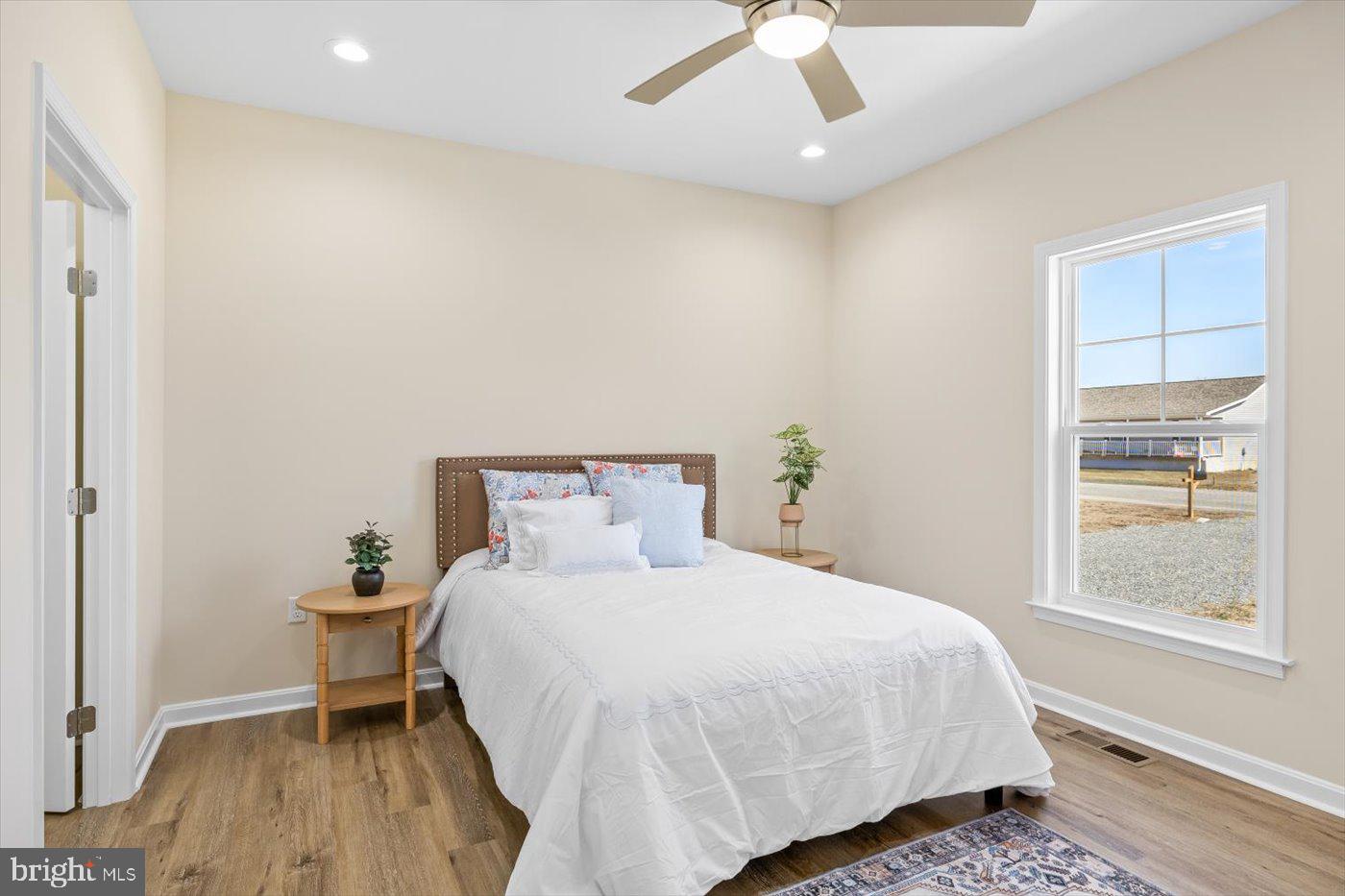 1419 South Glebe Road Montross, VA 22520 - Photo 41 of 76 a bedroom with a bed and wooden floor