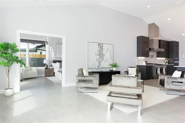a living room with furniture and a book shelf