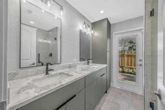 an aerial view of a house with outdoor space