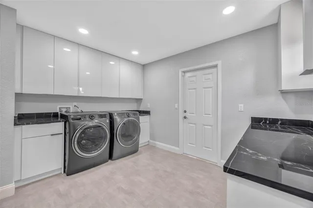 an aerial view of a house with a swimming pool
