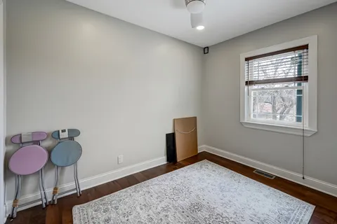 a livingroom with furniture a rug and a chandelier