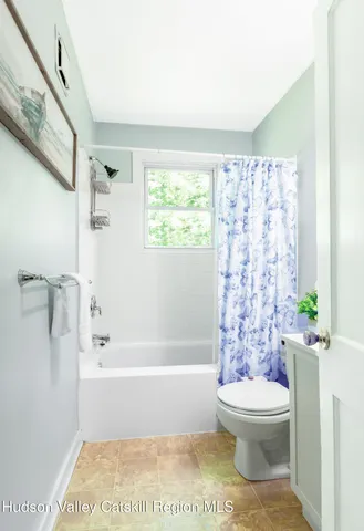 a bathroom with a toilet a sink and a bathtub