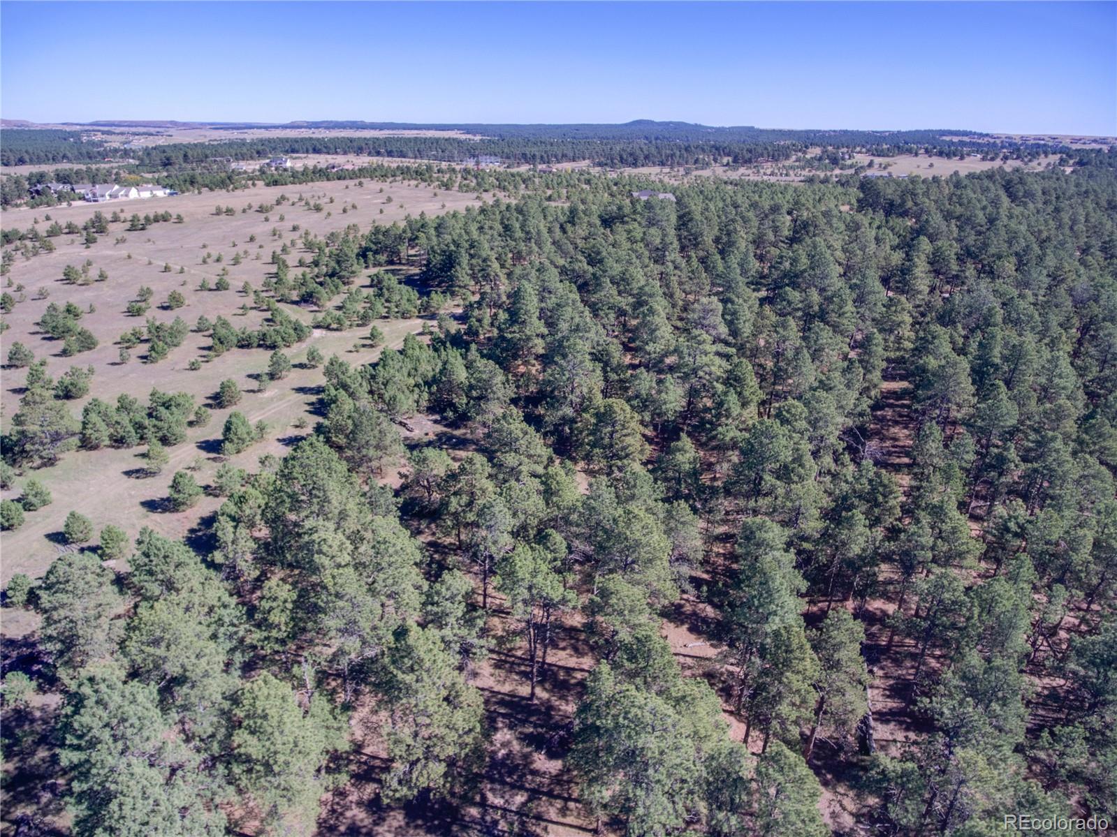 1868 East Baptist Road Monument, CO 80132 - Photo 5 of 27 a view of a city with lush green forest