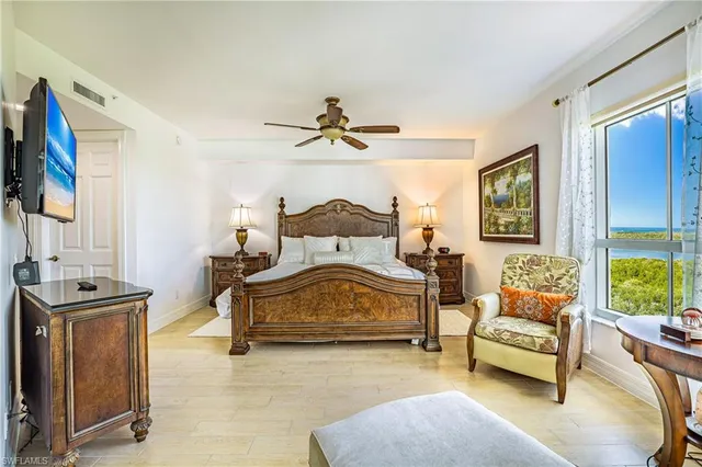 a bedroom with a bed and a couch