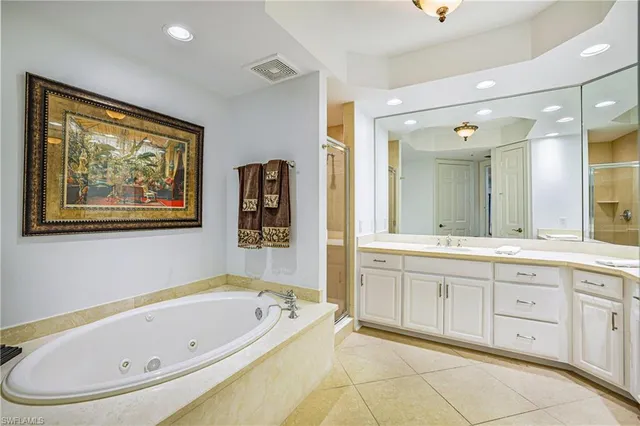 a bathroom with a bathtub and a sink