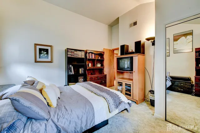 a bedroom with a bed and furniture