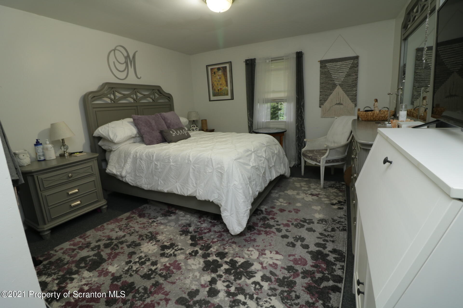 4 Prospect Street Simpson, PA 18407 - Photo 13 of 41 a bedroom with a bed and a dresser