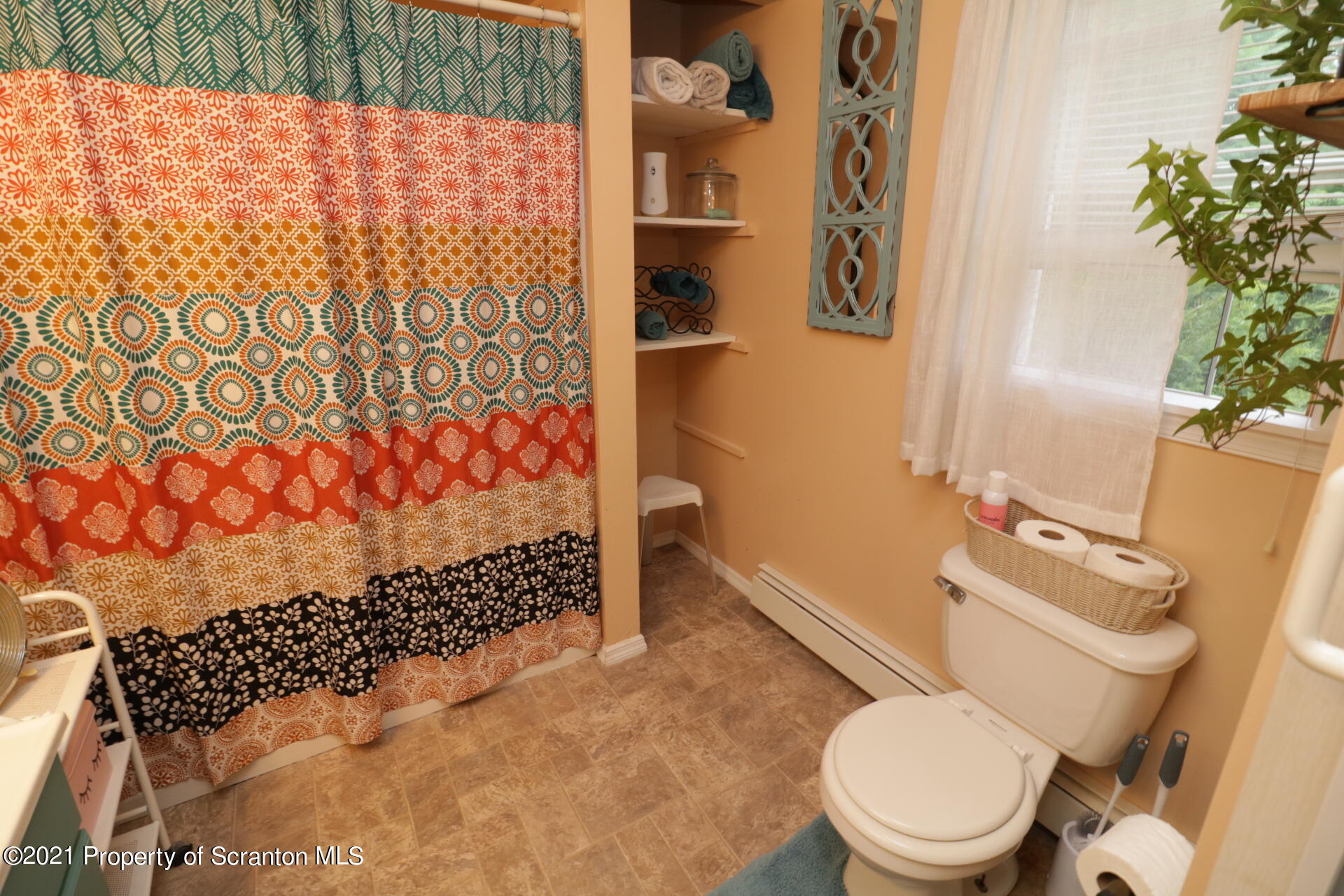 4 Prospect Street Simpson, PA 18407 - Photo 16 of 41 a white toilet sitting next to a shower curtain