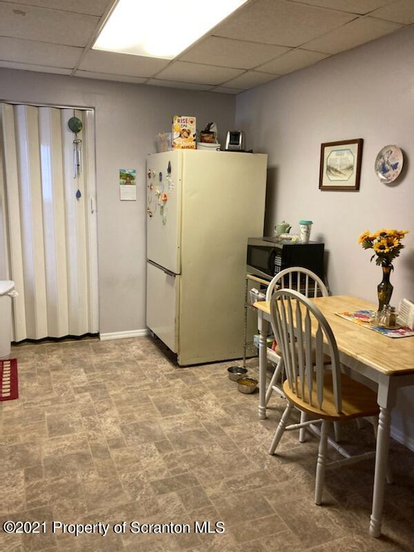 4 Prospect Street Simpson, PA 18407 - Photo 21 of 41 a view of a kitchen with fridge and workspace