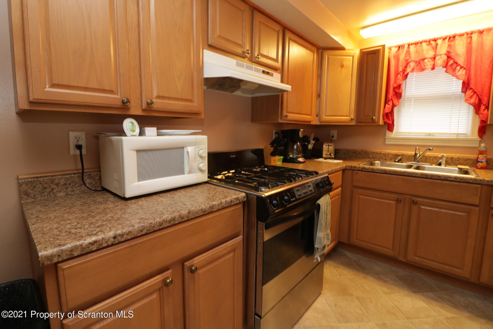 4 Prospect Street Simpson, PA 18407 - Photo 27 of 41 a kitchen with a sink stove and cabinets