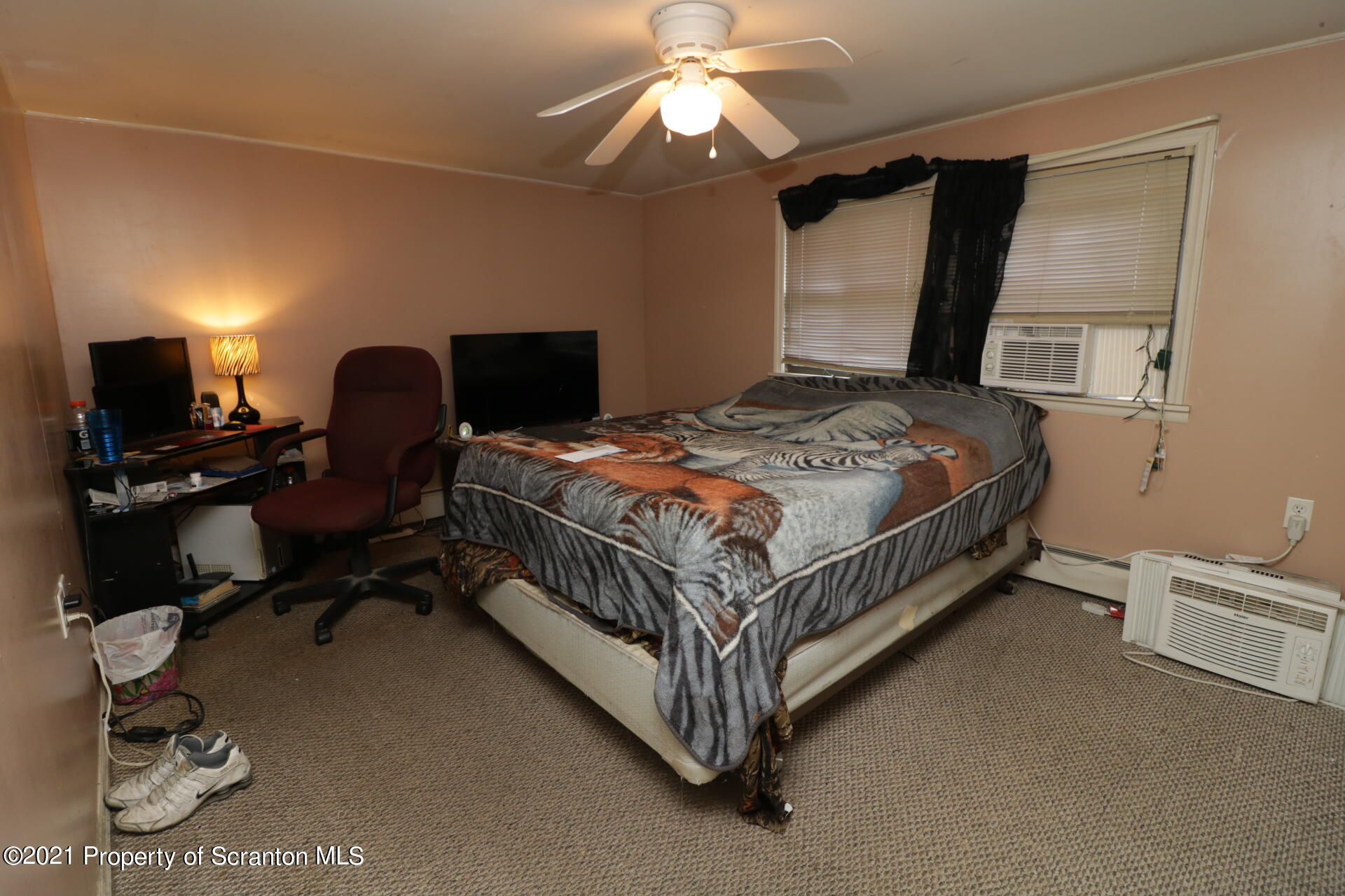 4 Prospect Street Simpson, PA 18407 - Photo 29 of 41 a bed room with a bed and a chandelier