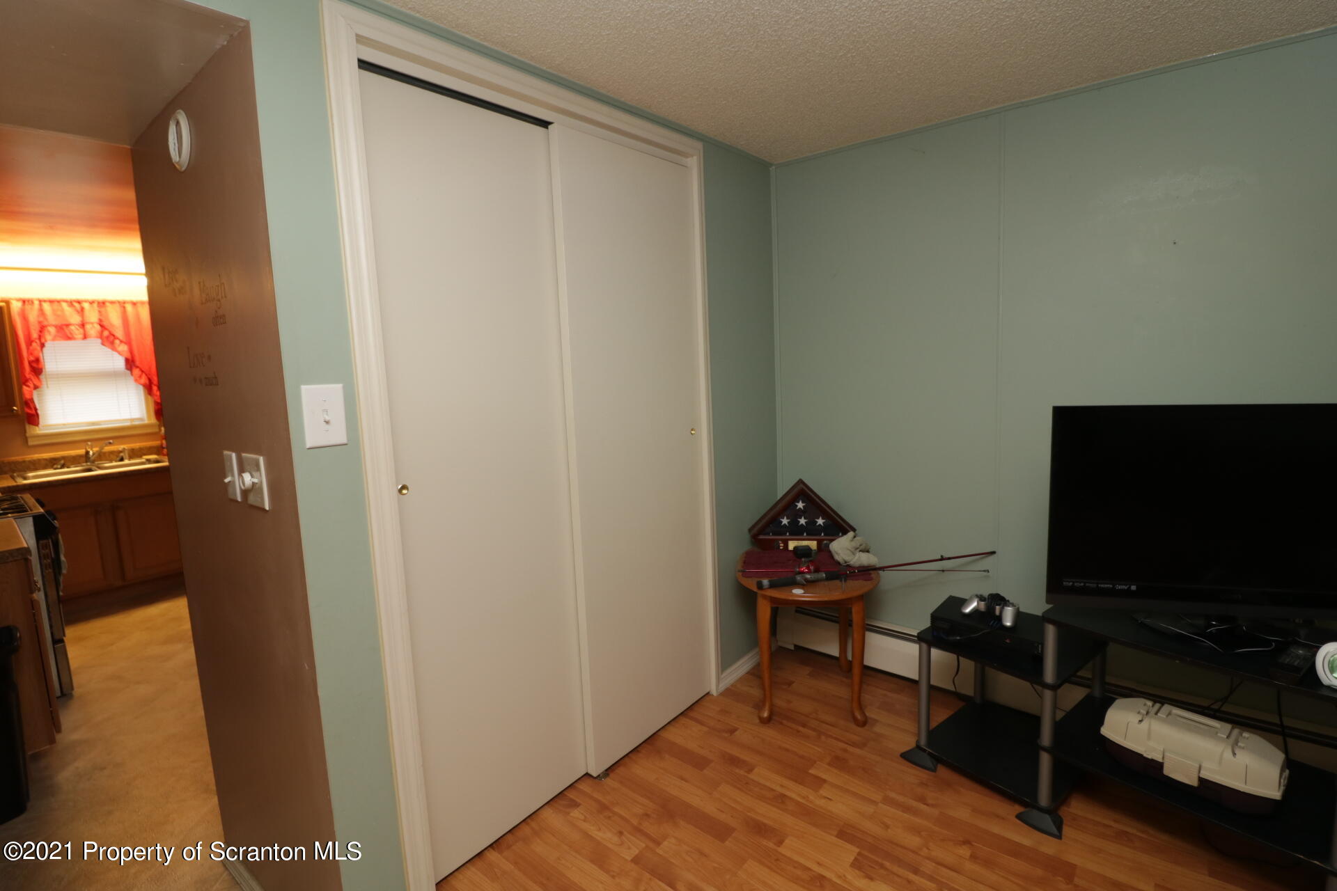 4 Prospect Street Simpson, PA 18407 - Photo 32 of 41 a living room with furniture and a flat screen tv
