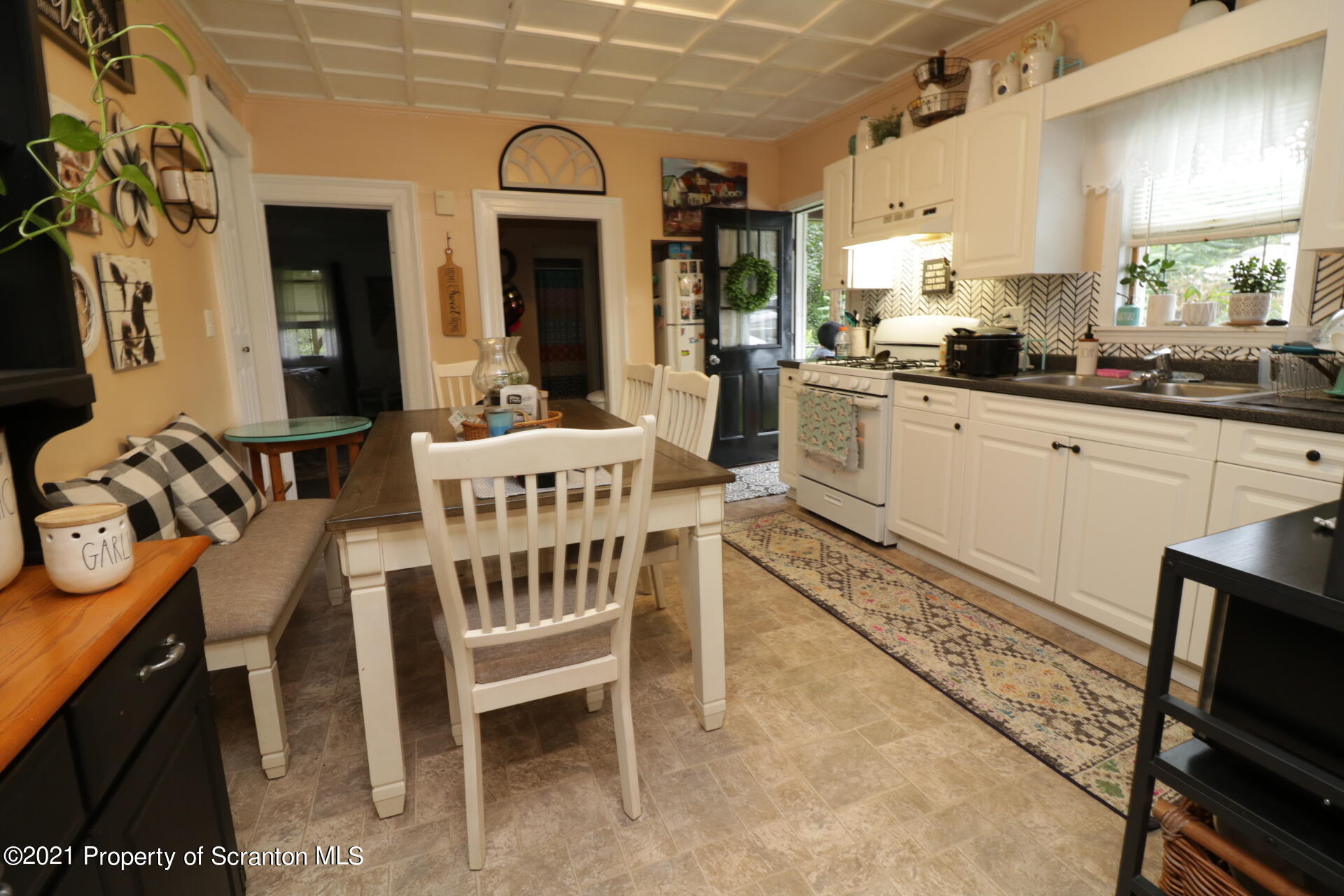 4 Prospect Street Simpson, PA 18407 - Photo 7 of 41 a large white kitchen with a large window