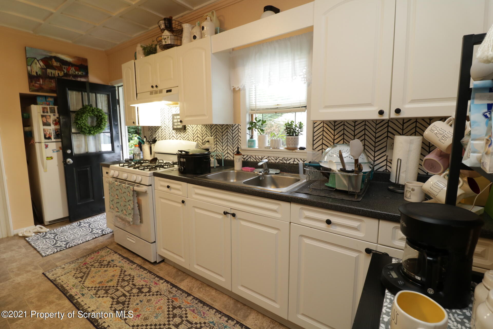 4 Prospect Street Simpson, PA 18407 - Photo 9 of 41 a kitchen with sink cabinets and appliances