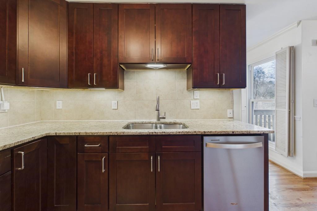 100 Colony Ridge Drive Alpharetta, GA 30022 - Photo 13 of 47 a kitchen with granite countertop cabinets sink and stove