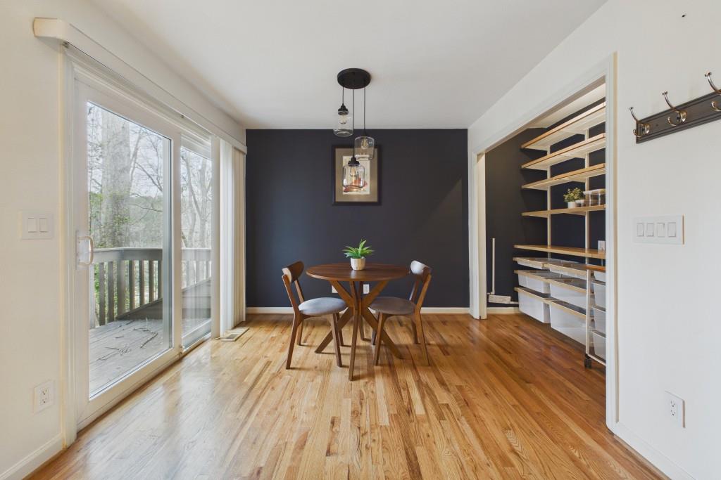 100 Colony Ridge Drive Alpharetta, GA 30022 - Photo 16 of 47 a view of a dining room with furniture and wooden floor
