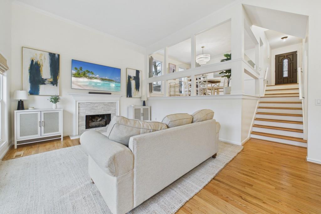 100 Colony Ridge Drive Alpharetta, GA 30022 - Photo 2 of 47 a living room with furniture and a fireplace