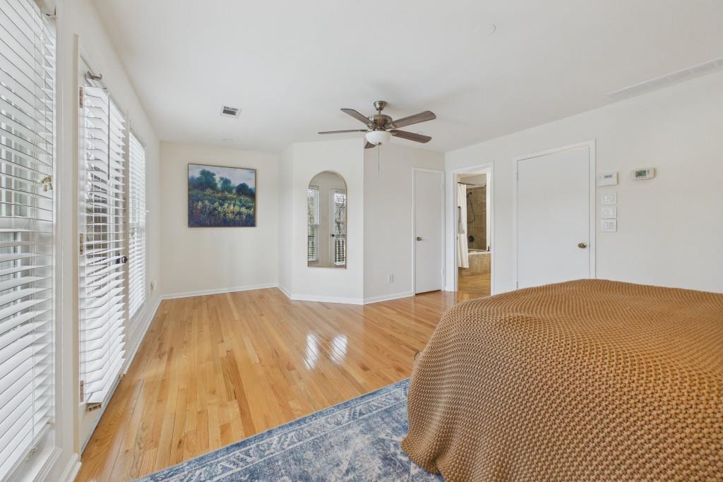 100 Colony Ridge Drive Alpharetta, GA 30022 - Photo 21 of 47 a bedroom with a bed and a chandelier
