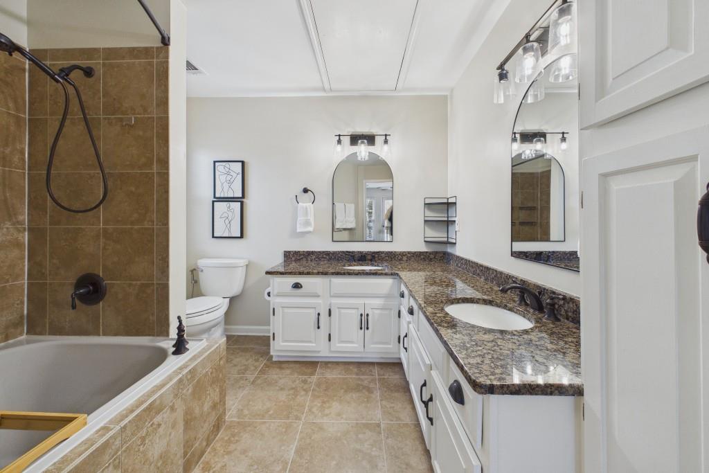 100 Colony Ridge Drive Alpharetta, GA 30022 - Photo 23 of 47 a spacious bathroom with a granite countertop tub sink and mirror