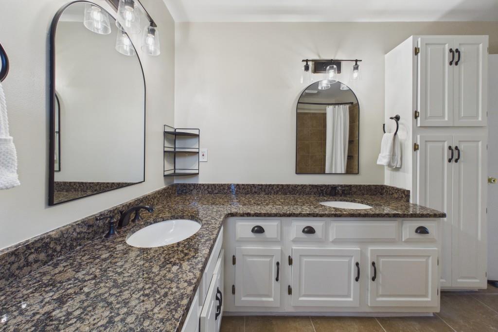 100 Colony Ridge Drive Alpharetta, GA 30022 - Photo 25 of 47 a bathroom with a granite countertop sink and a mirror