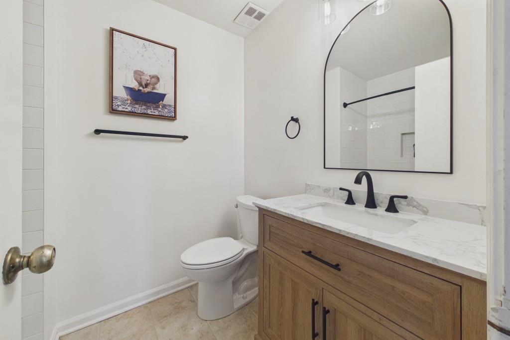 100 Colony Ridge Drive Alpharetta, GA 30022 - Photo 30 of 47 a bathroom with a toilet sink and mirror