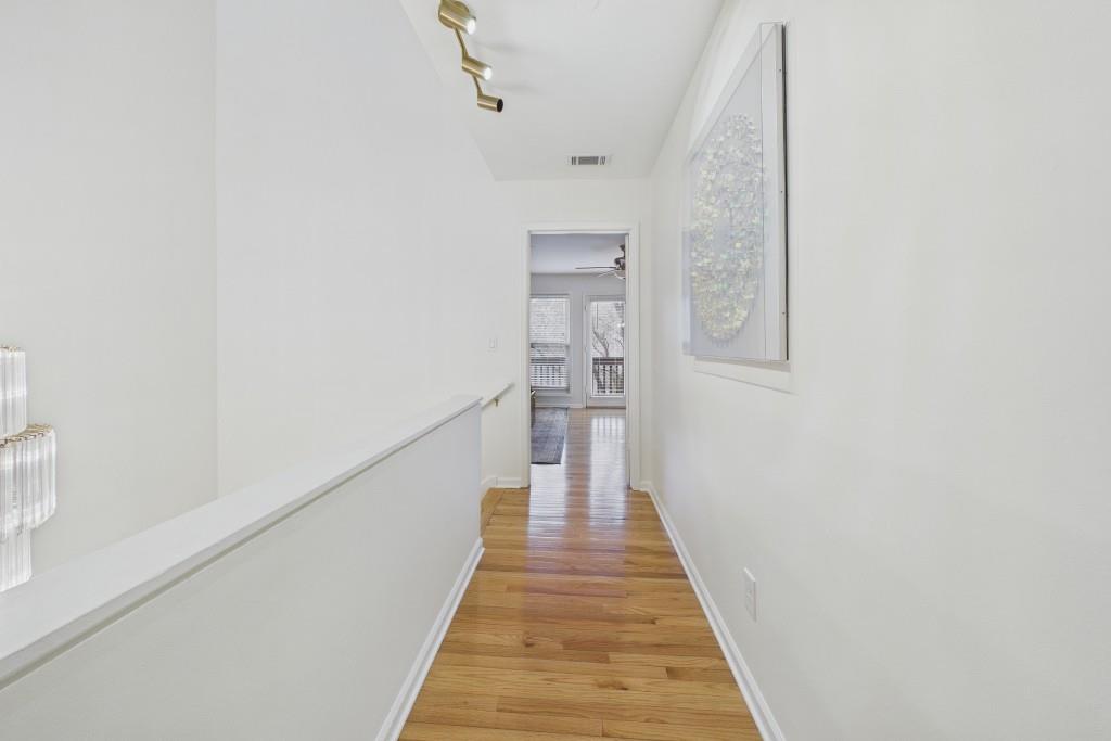 100 Colony Ridge Drive Alpharetta, GA 30022 - Photo 32 of 47 a view of a hallway with wooden floor and staircase