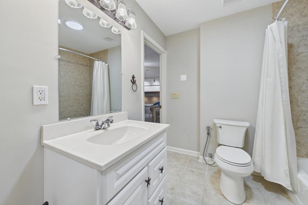 100 Colony Ridge Drive Alpharetta, GA 30022 - Photo 37 of 47 a bathroom with a sink a toilet and a mirror