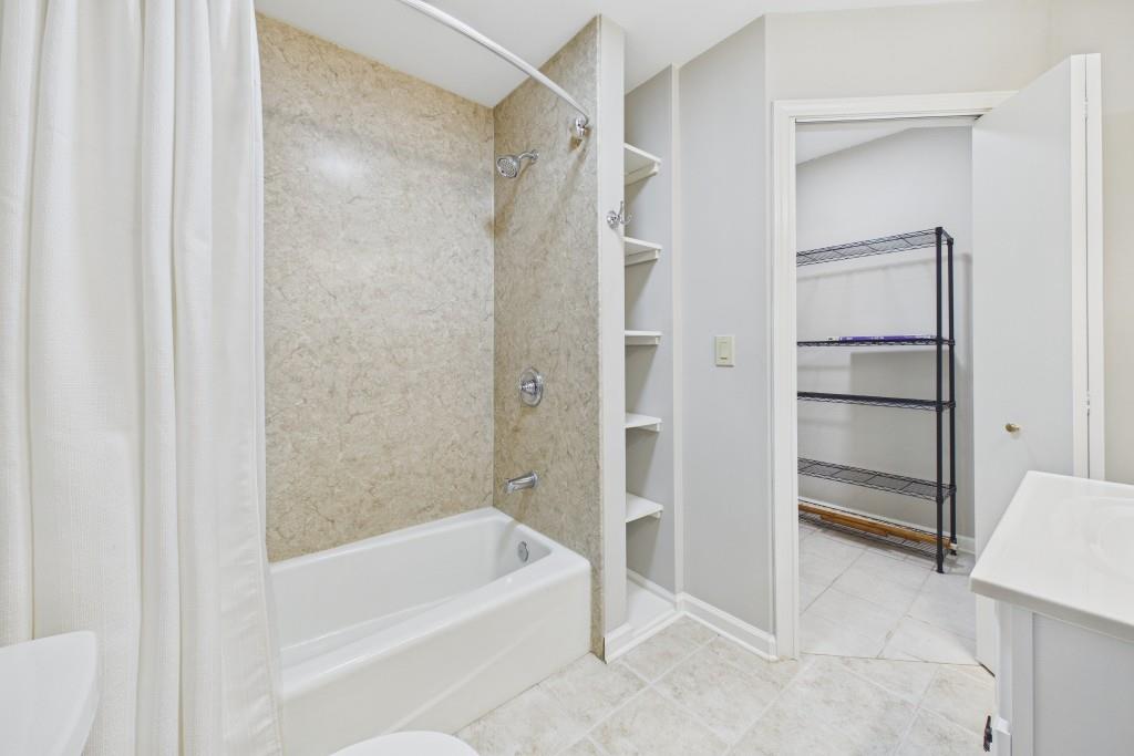 100 Colony Ridge Drive Alpharetta, GA 30022 - Photo 38 of 47 a bathroom with a bathtub and a shower