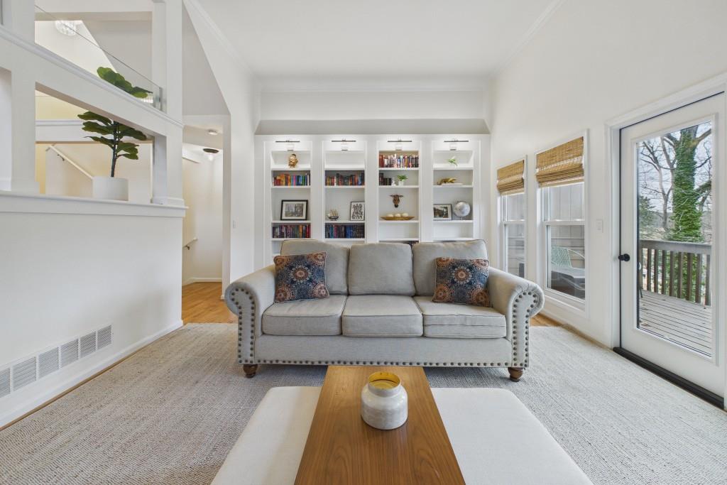 100 Colony Ridge Drive Alpharetta, GA 30022 - Photo 5 of 47 a living room with furniture and a floor to ceiling window