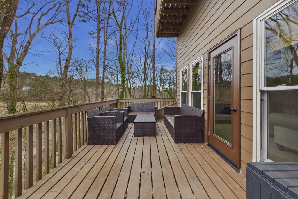100 Colony Ridge Drive Alpharetta, GA 30022 - Photo 6 of 47 a view of balcony with furniture and wooden floor