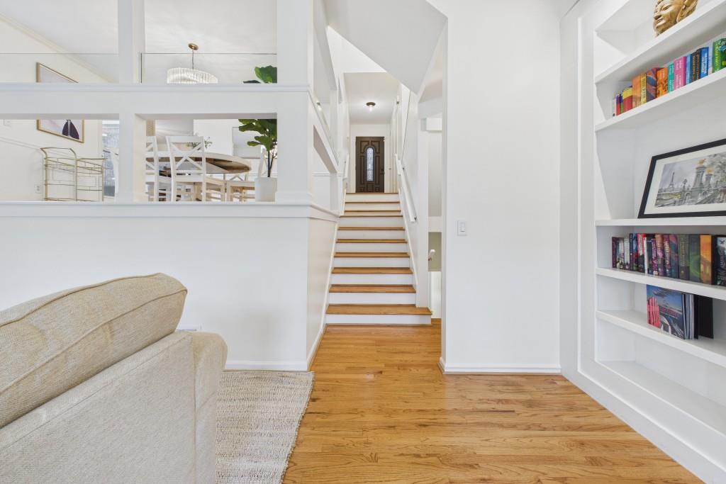 100 Colony Ridge Drive Alpharetta, GA 30022 - Photo 7 of 47 a view of a hallway with wooden floor and cabinets