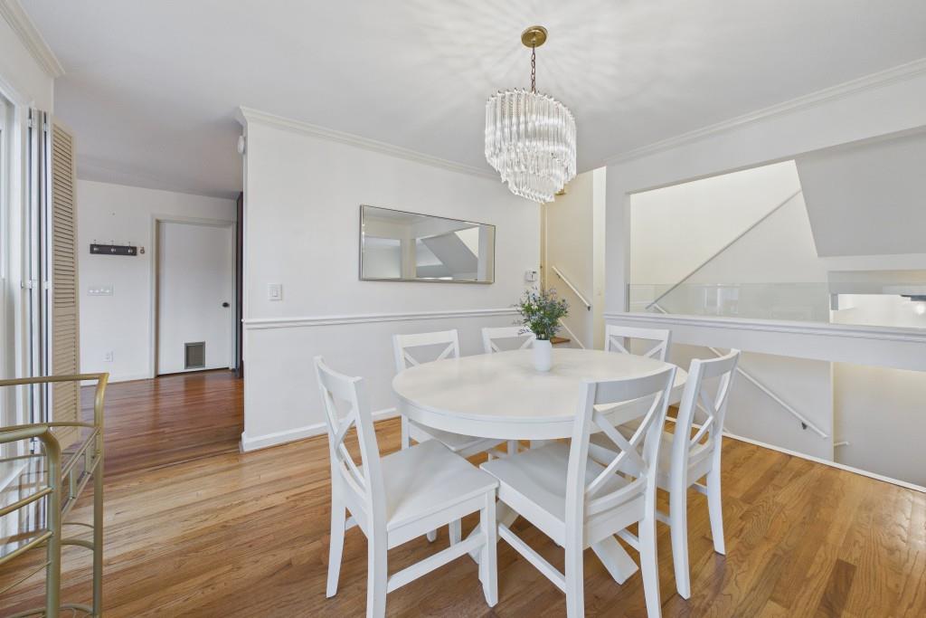 100 Colony Ridge Drive Alpharetta, GA 30022 - Photo 8 of 47 a view of a dining room with furniture and wooden floor
