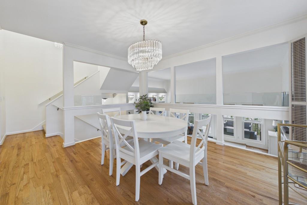 100 Colony Ridge Drive Alpharetta, GA 30022 - Photo 10 of 47 a view of a dining room with furniture wooden floor and chandelier