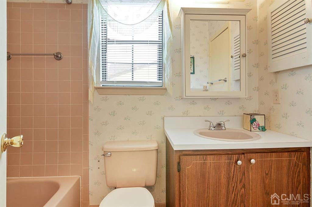67 Redbud Road Piscataway, NJ 08854 - Photo 13 of 23 a bathroom with a sink a toilet and shower