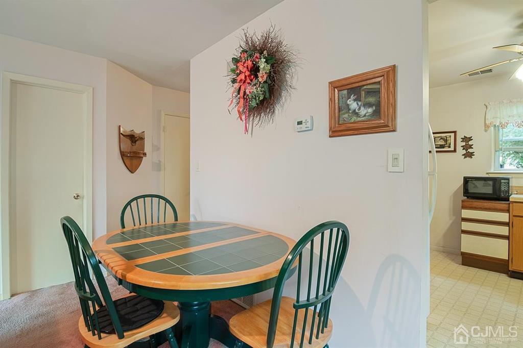 67 Redbud Road Piscataway, NJ 08854 - Photo 6 of 23 a view of a dining room with furniture and wooden floor