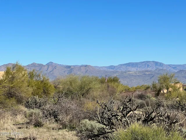 a view of a town with mountains in the background