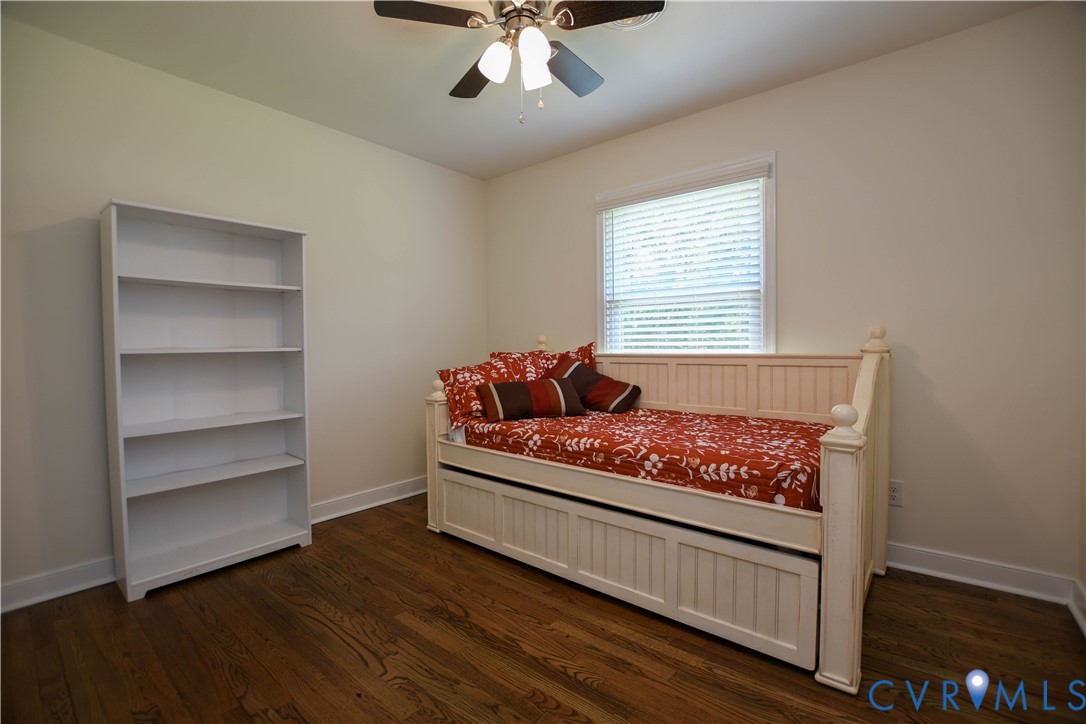 1448 Canterbury Road St. Stephens Church, VA 23148 - Photo 25 of 57 Hardwood flooring throughout featuring white baseb
