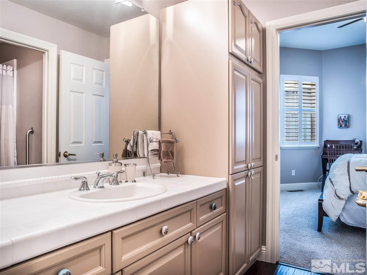 2531 Range View Lane Reno, NV 89519 - Photo 12 of 24 a en suite bathroom with a sink double vanity and a mirror