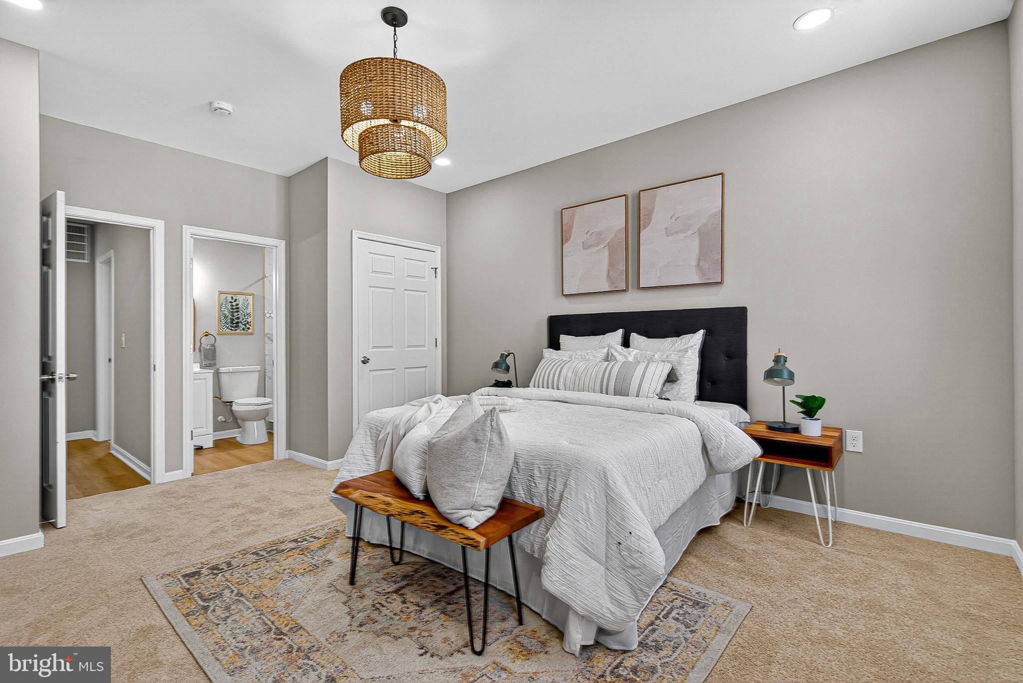 1725 East Oliver Street Baltimore, MD 21213 - Photo 12 of 30 a bedroom with a bed and a painting on the wall