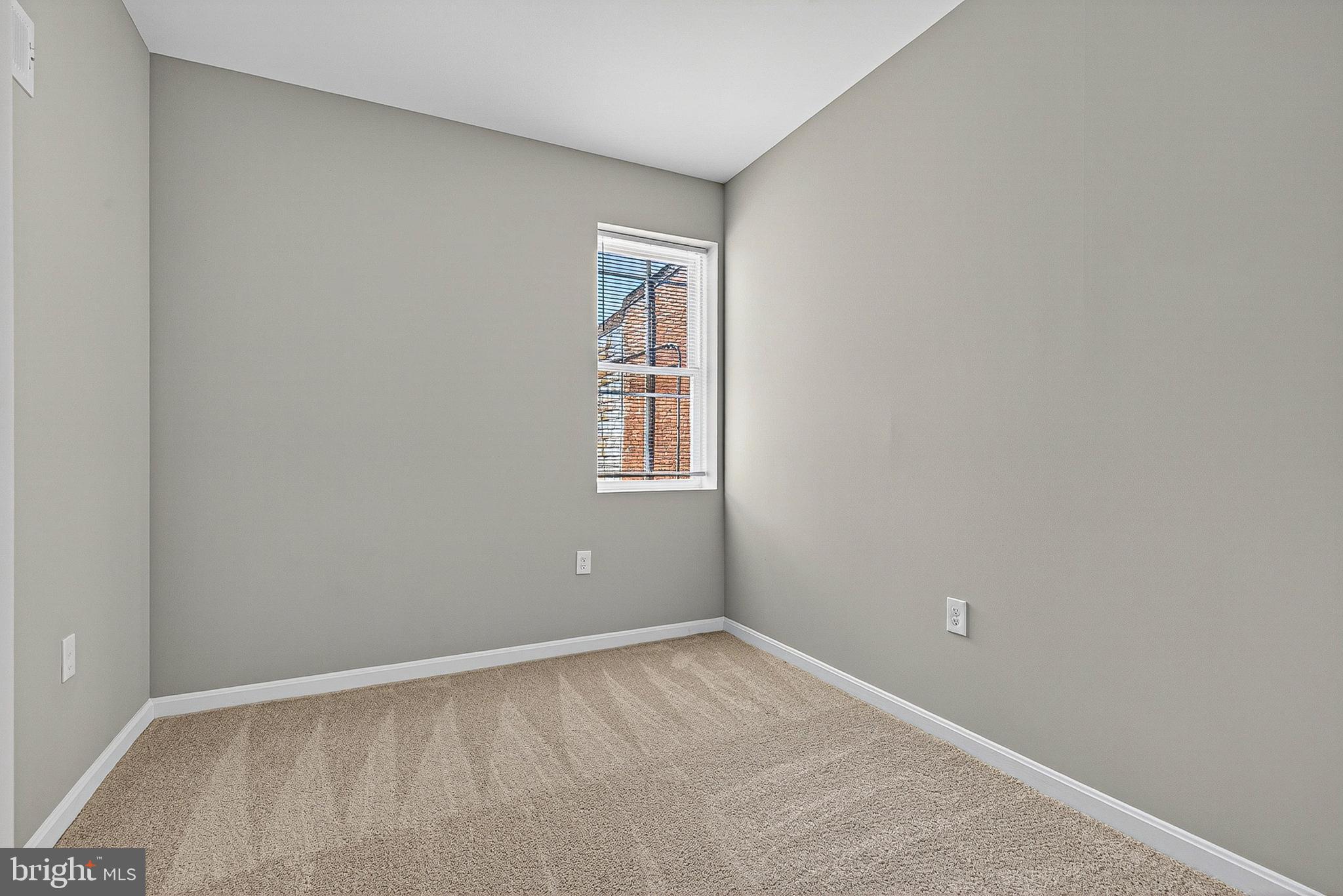 1725 East Oliver Street Baltimore, MD 21213 - Photo 15 of 30 a view of an empty room with a window