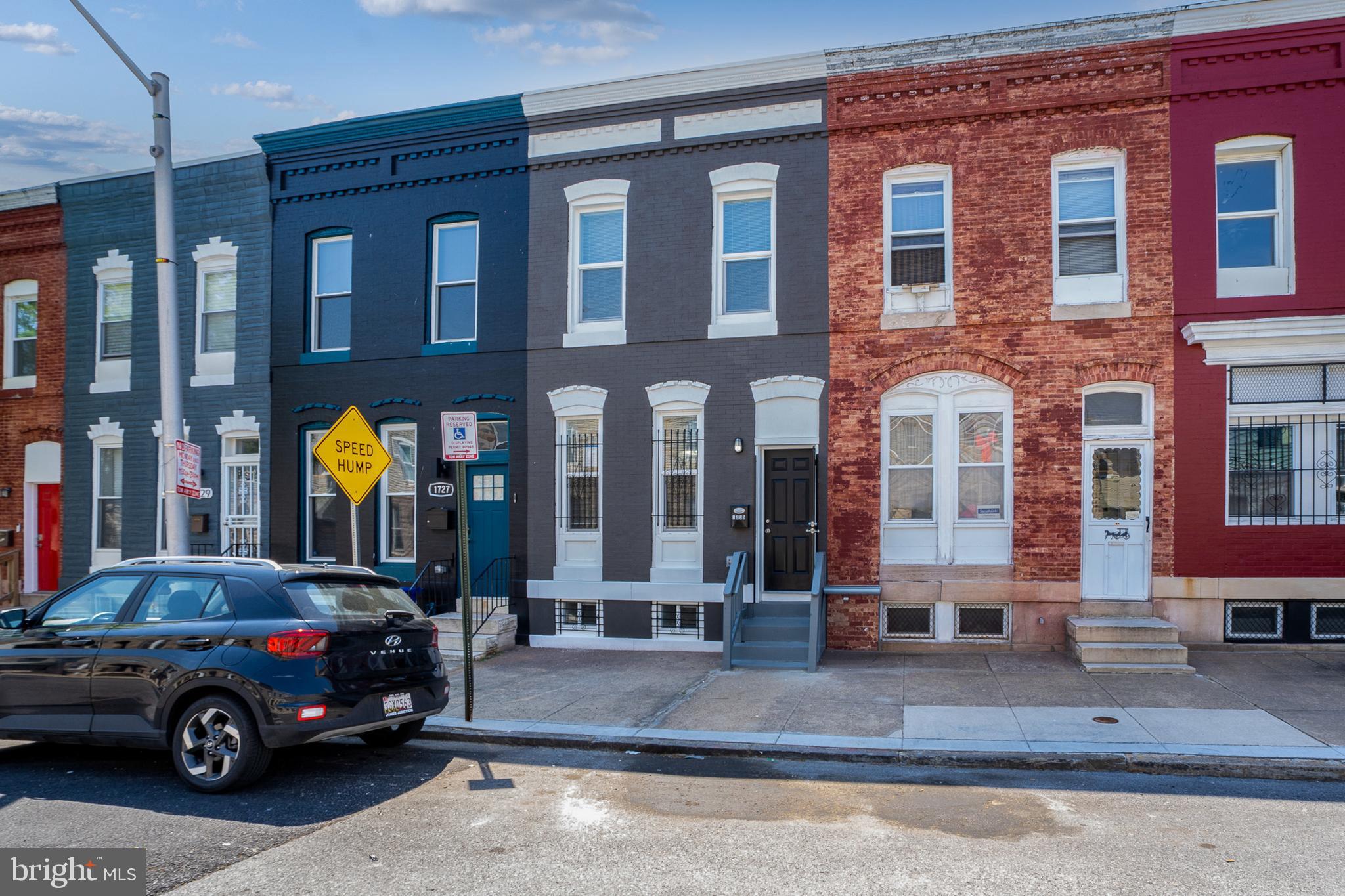 1725 East Oliver Street Baltimore, MD 21213 - Photo 29 of 30 a view of a car parked in front of a building