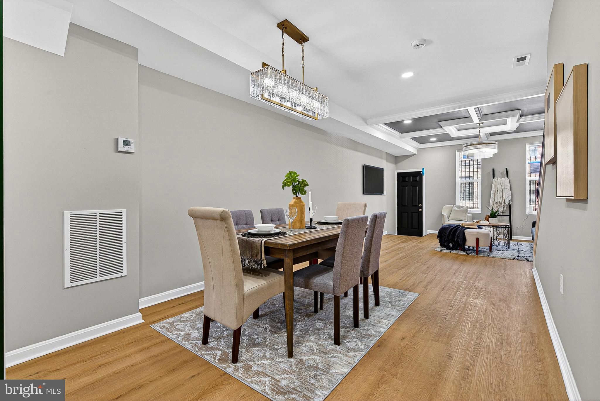 1725 East Oliver Street Baltimore, MD 21213 - Photo 7 of 30 a view of a dining room with furniture and wooden floor