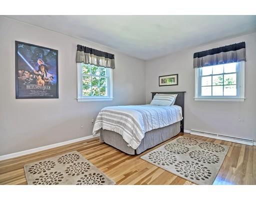 48 Everett Circle Stoughton, MA 02072 - Photo 14 of 34 a bedroom with a bed and a window