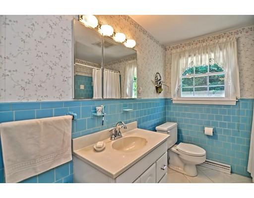 48 Everett Circle Stoughton, MA 02072 - Photo 20 of 34 a bathroom with a toilet a sink and mirror