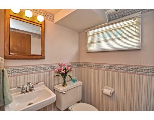 48 Everett Circle Stoughton, MA 02072 - Photo 26 of 34 a bathroom with a sink toilet and mirror