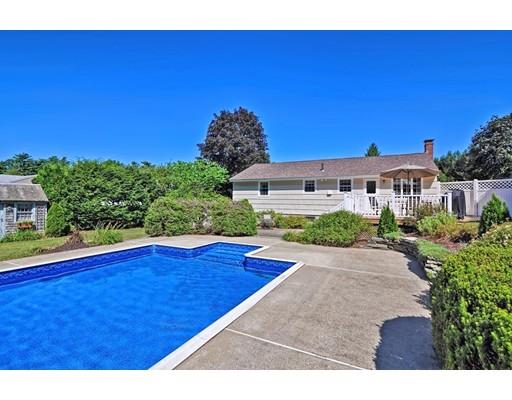 48 Everett Circle Stoughton, MA 02072 - Photo 30 of 34 a view of a swimming pool with an outdoor space and seating area