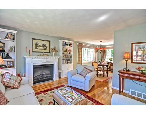 48 Everett Circle Stoughton, MA 02072 - Photo 4 of 34 a living room with furniture a rug and a fireplace
