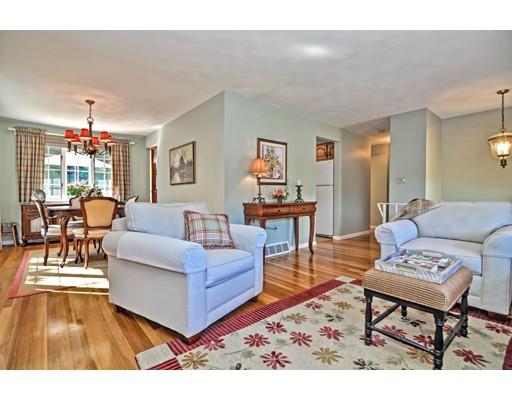 48 Everett Circle Stoughton, MA 02072 - Photo 6 of 34 a living room with furniture and a dining table