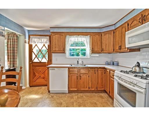 48 Everett Circle Stoughton, MA 02072 - Photo 9 of 34 a kitchen with a window a sink and a microwave