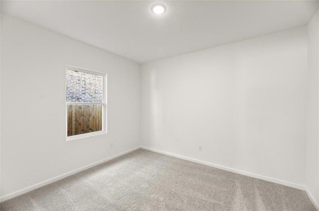 10308 Holy Cross Lane Crowley, TX 76036 - Photo 6 of 27 an empty room with a window